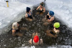 People gathered around cold water — cold-water immersion practice