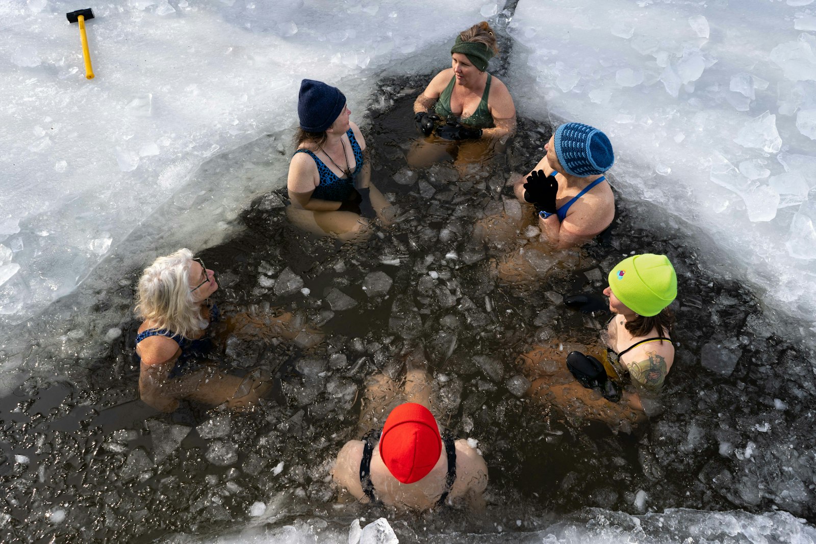 People gathered around cold water — cold-water immersion practice