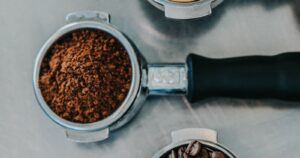 cup of coffee with coffee beans