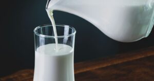 pouring milk into a glass